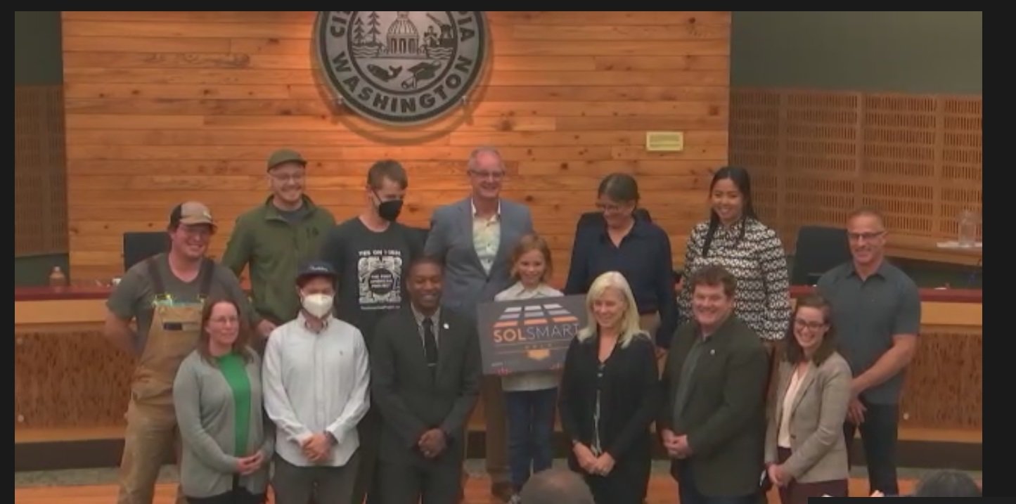 Dr. Pamela Braff, Olympia Climate Program manager, presented the SolSmart Gold designation plaque to the city council on Tuesday, September 21, 2022. Olympia received the gold designation from the Department of Energy-sponsored SolSmart program for its solar energy campaign.